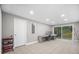Finished basement with tile flooring, desk, and sliding doors to the outside at 2086 Mountain Creek Ct, Stone Mountain, GA 30087