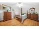 Traditional bedroom with four-poster bed, hardwood floors, and ample closet space at 2086 Mountain Creek Ct, Stone Mountain, GA 30087