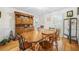 Well-lit dining room with hardwood floors, a traditional hutch, and ample seating for gatherings at 2086 Mountain Creek Ct, Stone Mountain, GA 30087