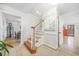Inviting foyer showcasing a staircase with wood and white accents and bright, neutral decor at 2086 Mountain Creek Ct, Stone Mountain, GA 30087