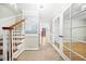 Well-lit foyer with hardwood staircase, beige tile floors, and access to the rest of the home at 2086 Mountain Creek Ct, Stone Mountain, GA 30087