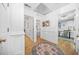 Hallway featuring hardwood floors, white trim, and access to the rest of the home at 2086 Mountain Creek Ct, Stone Mountain, GA 30087