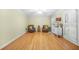 Sitting room featuring hardwood floors, neutral paint, and bright white shutters at 2086 Mountain Creek Ct, Stone Mountain, GA 30087
