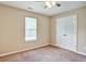 Cozy bedroom with neutral walls, plush carpeting, and a large closet at 501 Barhams Ridge Dr, Mcdonough, GA 30252