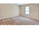Bright bedroom with a ceiling fan, and neutral walls with plush carpet at 501 Barhams Ridge Dr, Mcdonough, GA 30252