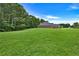 A beautiful shot of the green lawn surrounding this well maintained home at 501 Barhams Ridge Dr, Mcdonough, GA 30252