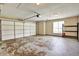 A standard garage with a garage door, plenty of room to store items, and a window for natural light at 501 Barhams Ridge Dr, Mcdonough, GA 30252