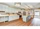 Bright kitchen features stainless steel appliances, center island, and white cabinetry at 501 Barhams Ridge Dr, Mcdonough, GA 30252