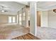 Spacious living room with neutral carpet, decorative columns and doorways, and bright light from the windows at 501 Barhams Ridge Dr, Mcdonough, GA 30252