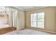 Well lit office space with neutral walls and carpet, large window, and white trim, showcasing an inviting atmosphere at 501 Barhams Ridge Dr, Mcdonough, GA 30252