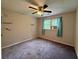 Bedroom with window, carpet floors, and neutral colored walls at 3989 Woodland Se Cir, Conyers, GA 30013