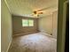 Bedroom featuring neutral colored walls, carpet floors, ceiling fan, and a bright window at 3989 Woodland Se Cir, Conyers, GA 30013