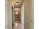 Hallway features tile floors and stairs to the upper level at 3989 Woodland Se Cir, Conyers, GA 30013