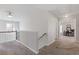 Hallway with neutral carpet leads to an office, perfect for a home work or study area at 109 Mill Creek Dr, Canton, GA 30115