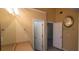 Bathroom with wood cabinets, mirrors, and an open doorway at 1956 Cutters Mill Way, Lithonia, GA 30058