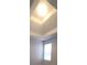 This bedroom features a tray ceiling and a large window that provides lots of natural light at 1956 Cutters Mill Way, Lithonia, GA 30058