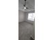 Bright bedroom features neutral carpet, ceiling fan, and large window allowing ample natural light at 1956 Cutters Mill Way, Lithonia, GA 30058