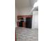A kitchen with a stove, microwave, cabinets, and gray linoleum flooring at 1956 Cutters Mill Way, Lithonia, GA 30058