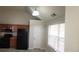 A kitchen with stainless steel appliances, wood cabinets, and gray linoleum flooring at 1956 Cutters Mill Way, Lithonia, GA 30058