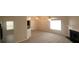 Open-concept living room with ample natural light and a cozy fireplace at 1956 Cutters Mill Way, Lithonia, GA 30058