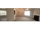 Open living room with fireplace and large windows at 1956 Cutters Mill Way, Lithonia, GA 30058