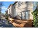 Cozy wooden deck in the backyard, perfect for outdoor seating and relaxation with a small stone area at 2515 Norwood Park Xing, Atlanta, GA 30340