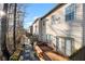 Backyard features a wood deck, gravel area, small garden and view of neighboring townhomes at 2515 Norwood Park Xing, Atlanta, GA 30340