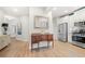 Open hallway leads to an entry featuring luxury vinyl plank floors and neutral paint at 2515 Norwood Park Xing, Atlanta, GA 30340