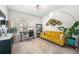 Bright home office with large window, modern light fixtures and yellow sofa at 2515 Norwood Park Xing, Atlanta, GA 30340