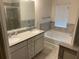 Bathroom featuring double vanity, soaking tub, separate shower, and tiled floor at 4353 Morning Vw, Stone Mountain, GA 30083