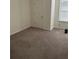 Bedroom with neutral carpet, one window with blinds, and white walls at 4353 Morning Vw, Stone Mountain, GA 30083