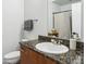 Well-lit bathroom featuring granite countertops, modern fixtures, and a shower/tub combo at 5300 Peachtree Rd # 0507, Atlanta, GA 30341