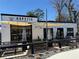 Charming restaurant featuring a shaded patio with string lights and comfortable seating areas at 5300 Peachtree Rd # 0507, Atlanta, GA 30341