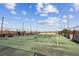 Outdoor tennis court with artificial turf in a fenced outdoor area for residents to enjoy at 5300 Peachtree Rd # 0507, Atlanta, GA 30341