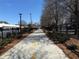 Scenic walkway with black metal fencing and lush landscaping, perfect for a stroll at 5300 Peachtree Rd # 0507, Atlanta, GA 30341