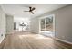 Bright living room showcasing natural light and leading to modern kitchen space at 5427 Fieldgreen Dr, Stone Mountain, GA 30088