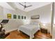 Cozy bedroom with hardwood floors, neutral decor, and a modern ceiling fan at 1080 Peachtree Ne St # 1208, Atlanta, GA 30309