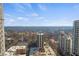 Expansive aerial view showcasing the city skyline and lush greenery, highlighting the property's prime location at 195 14Th Ne St # 2105, Atlanta, GA 30309