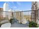 Relaxing balcony with city views, stylish seating, and planters, creating a tranquil outdoor space at 195 14Th Ne St # 2105, Atlanta, GA 30309