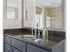 Bathroom featuring granite countertops and a glass-enclosed shower at 195 14Th Ne St # 2105, Atlanta, GA 30309