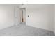 Neutrally decorated bedroom featuring grey carpet and a doorway to another room at 195 14Th Ne St # 2105, Atlanta, GA 30309