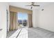 Bright bedroom with a ceiling fan and sliding doors to balcony area at 195 14Th Ne St # 2105, Atlanta, GA 30309