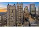 Stunning high-rise condo building with beautiful architecture against a vibrant sunset sky at 195 14Th Ne St # 2105, Atlanta, GA 30309