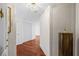 Inviting hallway features hardwood floors, elegant light fixture, and stylish decor, creating a welcoming ambiance at 195 14Th Ne St # 2105, Atlanta, GA 30309