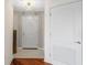 Bright hallway boasts tile floors, a modern light fixture, and white doors, creating a clean and welcoming space at 195 14Th Ne St # 2105, Atlanta, GA 30309