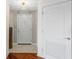 Inviting hallway with tile and hardwood floors leading to various rooms with modern doors at 195 14Th Ne St # 2105, Atlanta, GA 30309