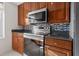 Modern kitchen featuring stainless steel appliances, granite countertops, and stylish backsplash at 195 14Th Ne St # 2105, Atlanta, GA 30309