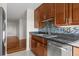 Well-lit kitchen featuring stainless steel appliances, wood cabinets and tile backsplash at 195 14Th Ne St # 2105, Atlanta, GA 30309