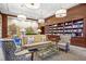 A charming library with bookshelves, comfortable seating, and soft lighting for reading and relaxation at 195 14Th Ne St # 2105, Atlanta, GA 30309