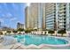 Outdoor pool with sundeck, lounge chairs, and city views. Perfect for relaxation and recreation at 195 14Th Ne St # 2105, Atlanta, GA 30309